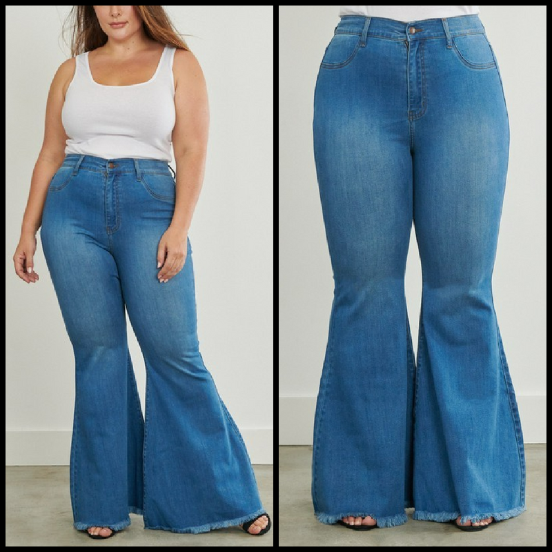 High waisted medium wash flare jeans with frayed hems.