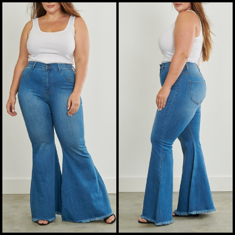High waisted medium wash flare jeans with frayed hems.