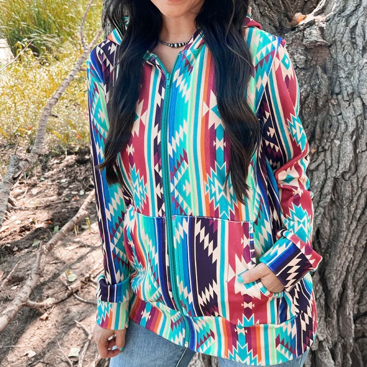 All the colors together in this zip up hooded jacket are a perfect blend! The aztec design makes it irresistible! Features a pouch style pocket on the front. It is so soft and definitely a must have for fall!  32% Cotton   56% Rayon   12% Spandex 